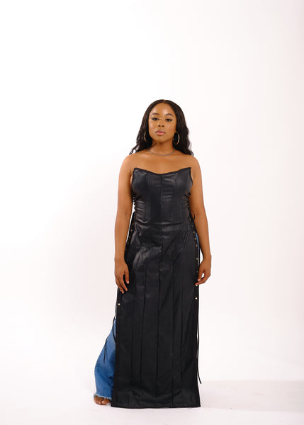 Black woman in long black leather dress