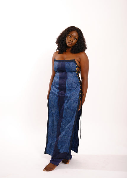 Black woman in blue tie dye dress